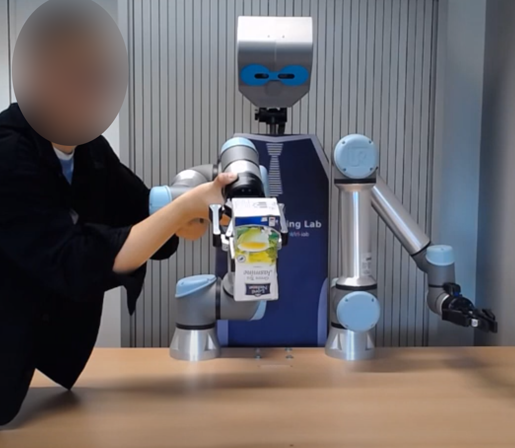 Figure 2: Kinesthetic teaching of the throwing kernel. A human demonstrator physically guides the robot arm through a throwing motion. This provides a safe initial kernel that bootstraps RL training and avoids unsafe random exploration.