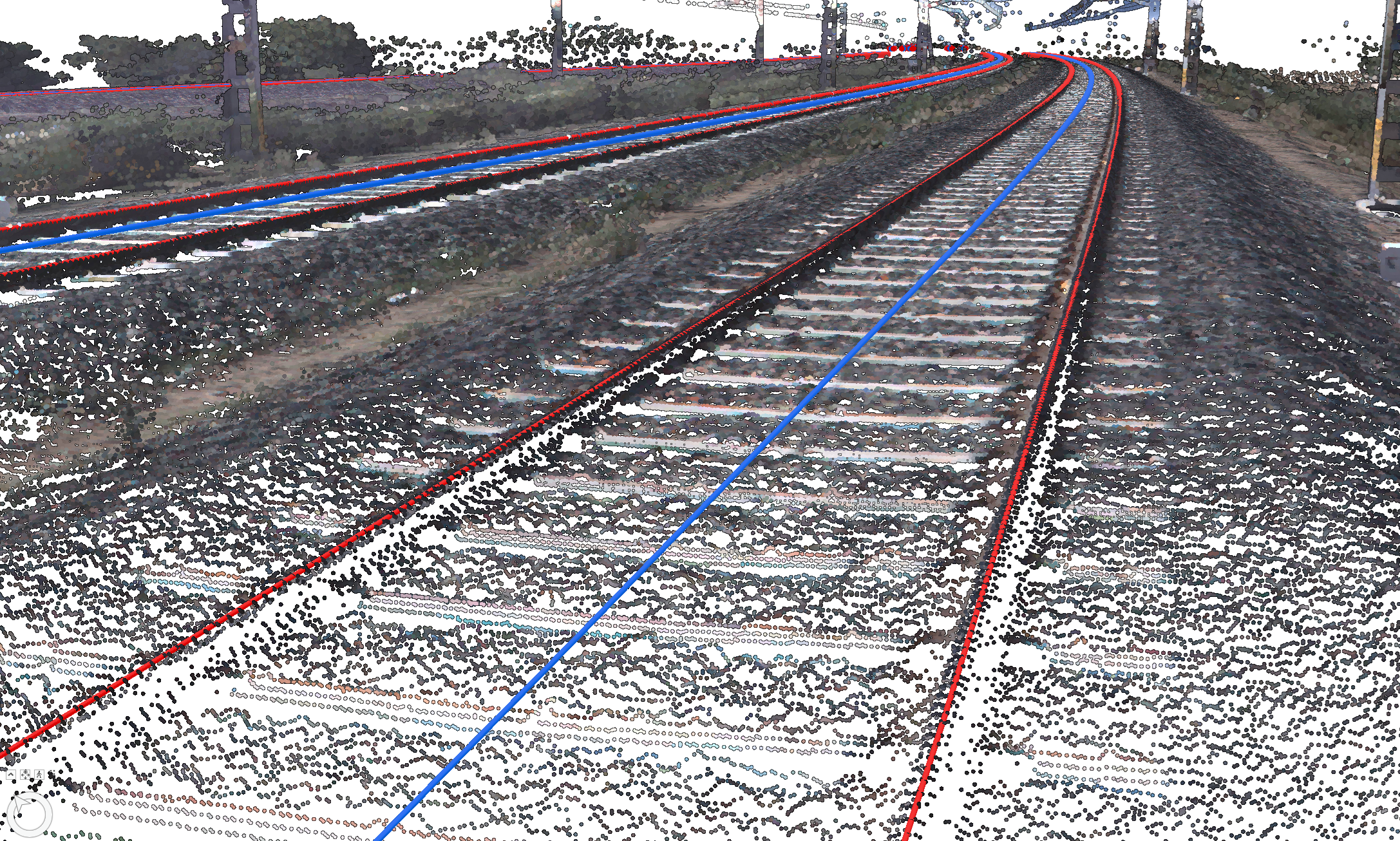 Figure 8: Example of extracting the railhead top-center polylines (red) for each rail and the resultant track center polyline (blue). Data courtesy of Esri India.